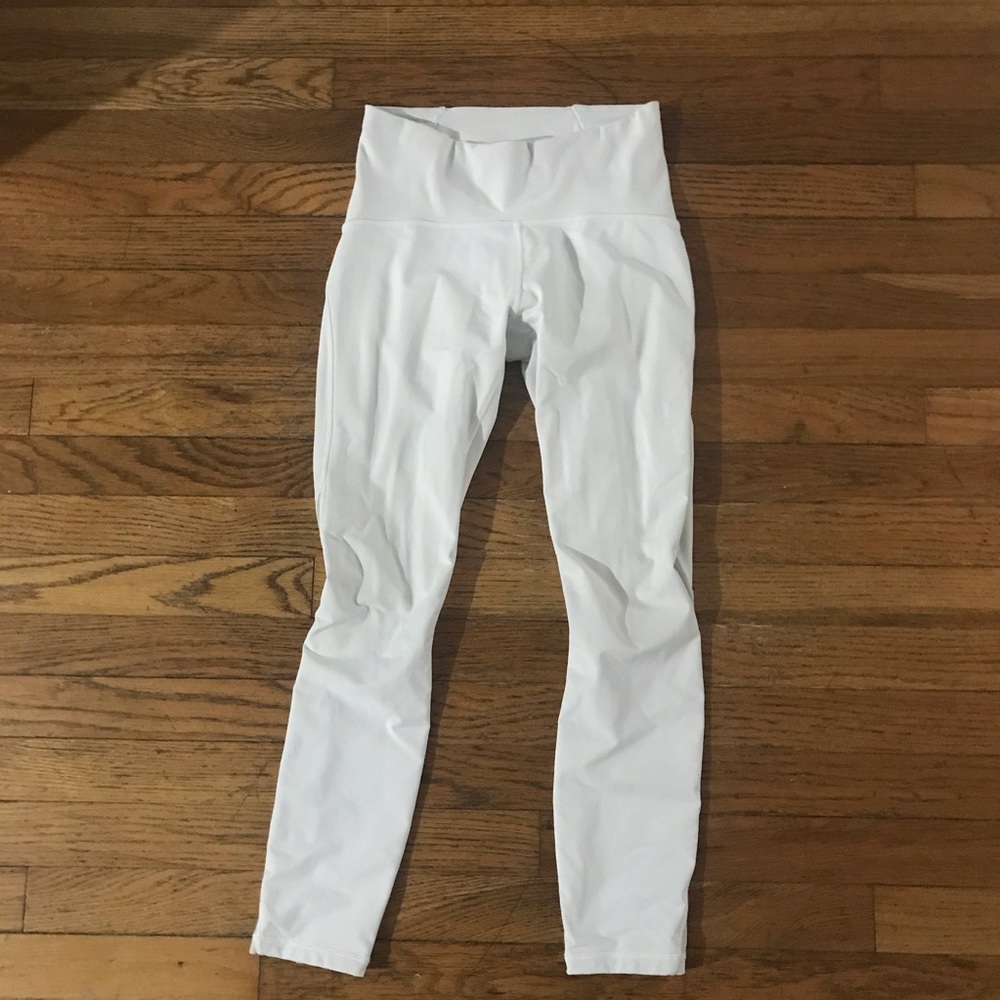Lululemon white leggings with see through detail on lower legs.